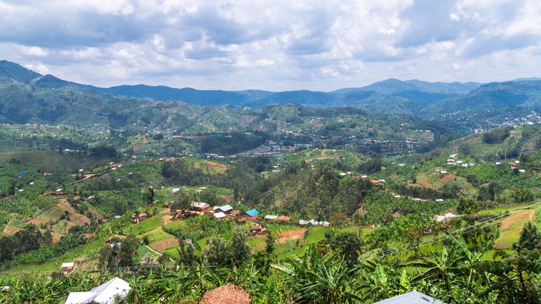 A landscape with hills and agricultural fields in Rwanda