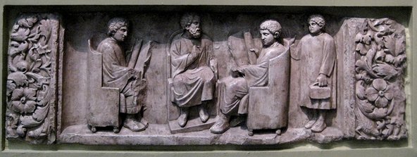 A relief of a Roman teacher with three discipuli. Image credit: Wikipedia / Shakko.