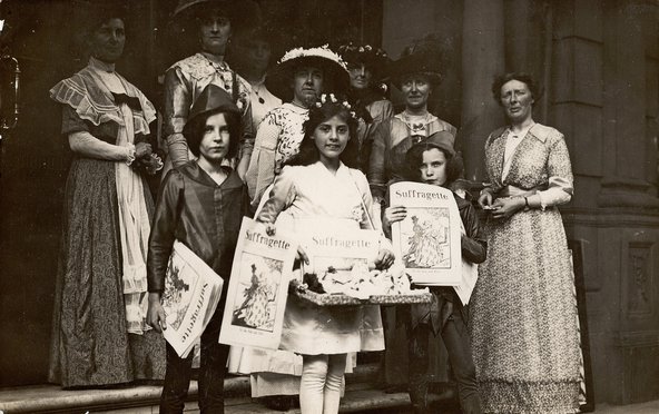 Group of children holding copies of 
