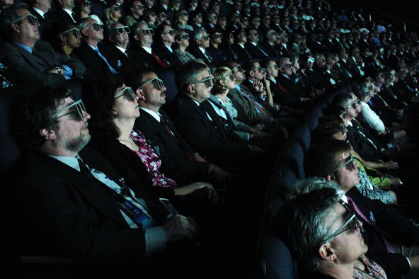An audience experiences 3D cinema